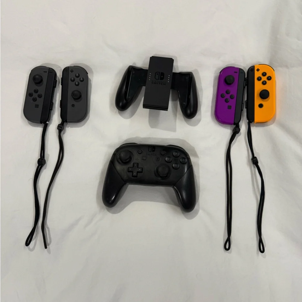 Nintendo Switch with Gray, Purple, and Orange Joy-Con Controllers